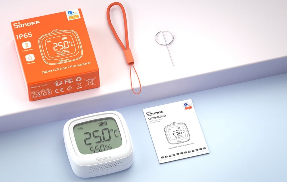 czujnik temperatury i wilgotności z pomarańczowym opakowaniem, instrukcją i zawieszką