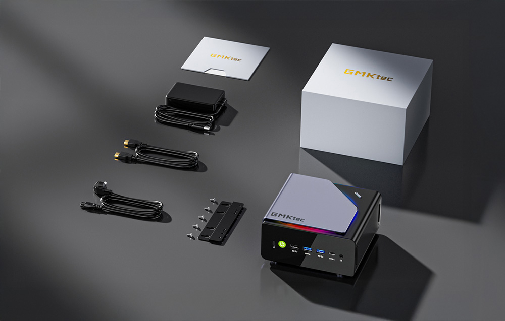 Περιεχόμενα του κιτ mini PC GMKtec που περιλαμβάνει υπολογιστή, τροφοδοτικό, καλώδια, βραχίονα τοποθέτησης, βίδες και οδηγίες χρήσης
