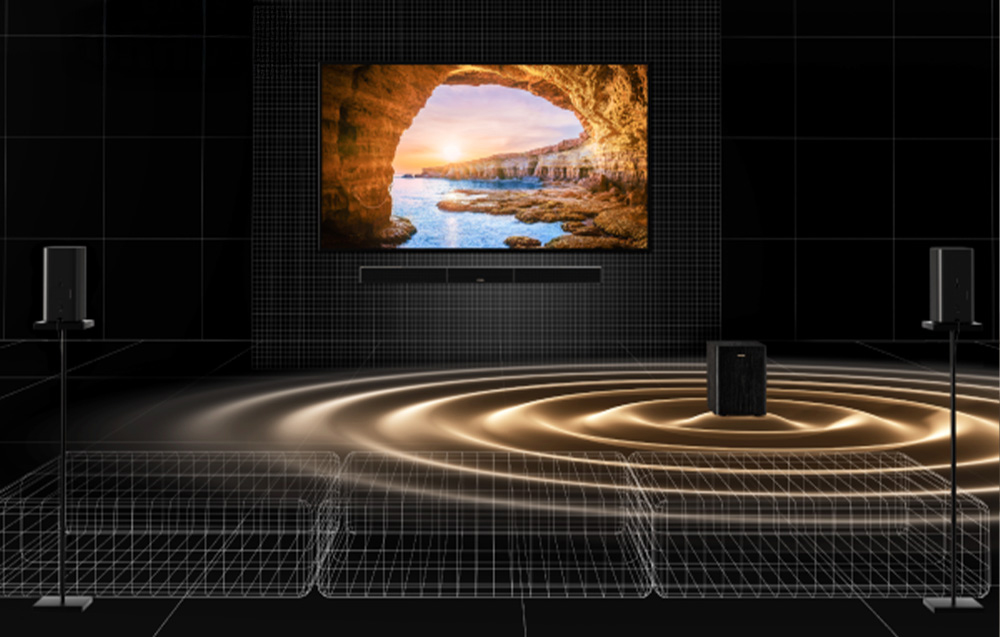 Σύστημα home theater με ηχομπάρα που εκπέμπει ηχητικά κύματα μπροστά από την τηλεόραση.