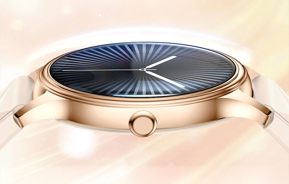 Πλάγια όψη της λεπτής θήκης ενός χρυσού smartwatch με κυρτό γυαλί και κλασικό πλευρικό κουμπί.