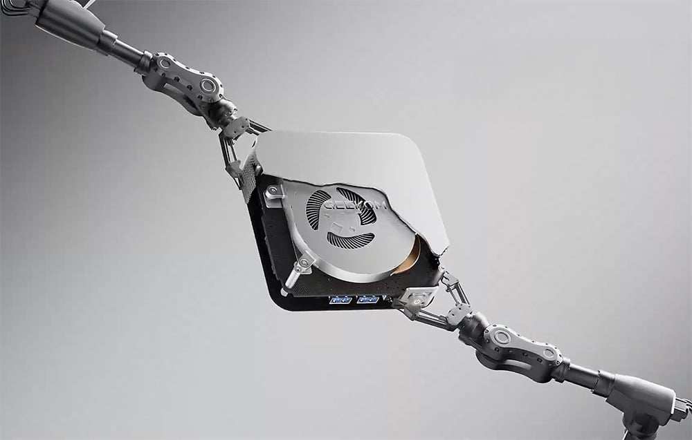 Γκρι Mini PC με ορατά εσωτερικά εξαρτήματα σε ανοιχτόχρωμο φόντο