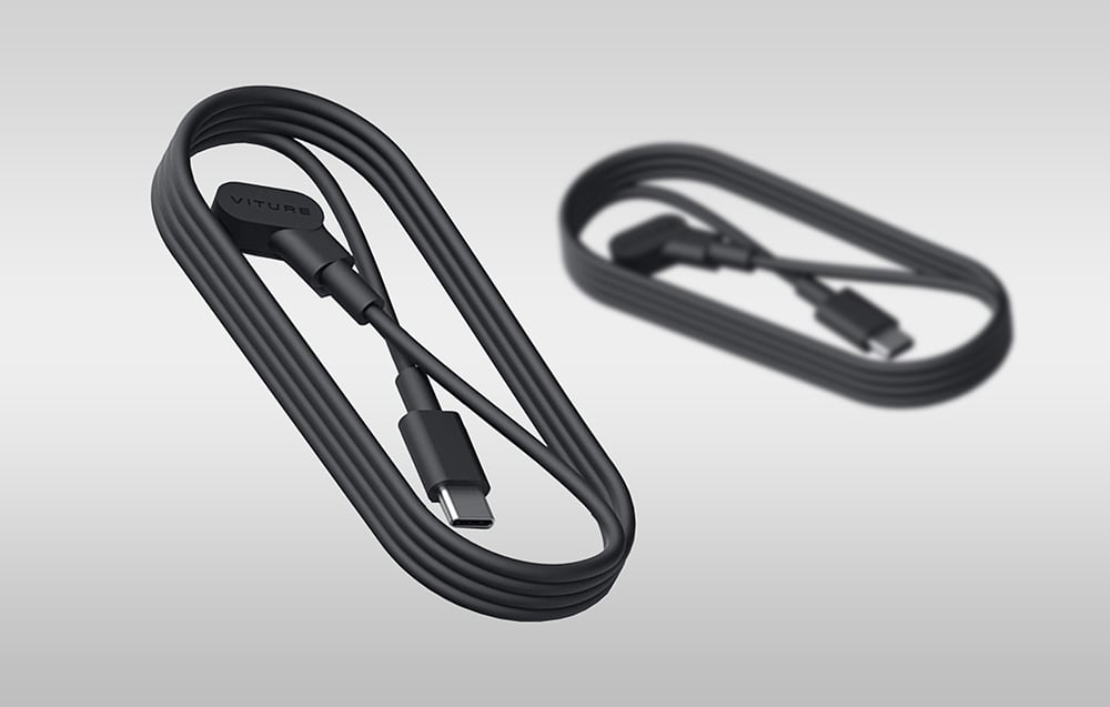 δύο μαύρα καλώδια USB για μαγνητική σύνδεση Viture σε γκρι φόντο