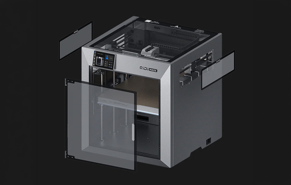 Κλειστός εκτυπωτής 3D με διαφανές περίβλημα και εξωτερική μονάδα συνδεδεμένη με καλώδιο.