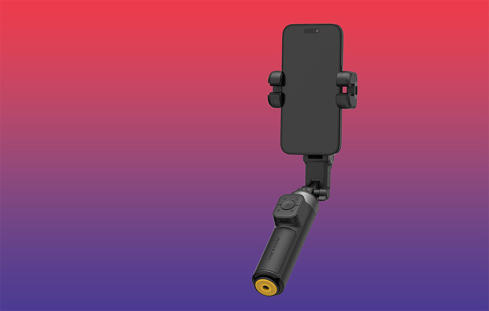 Μαύρο gimbal με smartphone σε κάθετη θέση πάνω σε φόντο με κόκκινο-μοβ ντεγκραντέ.