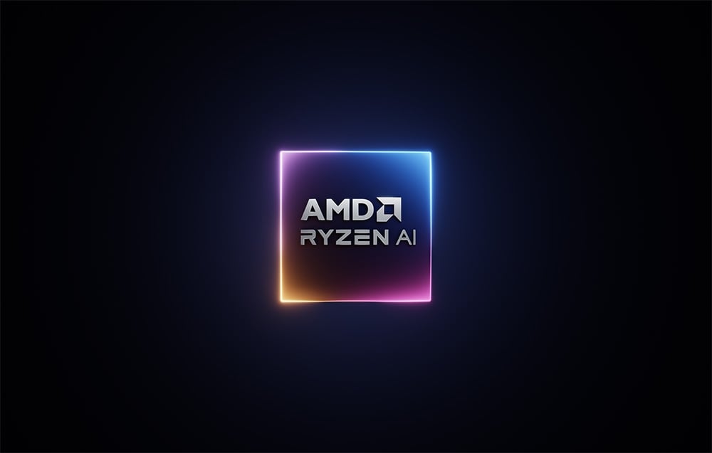Το λογότυπο AMD Ryzen AI σε φωτεινό πλαίσιο πάνω σε μαύρο φόντο, που συμβολίζει την απόδοση του επεξεργαστή.