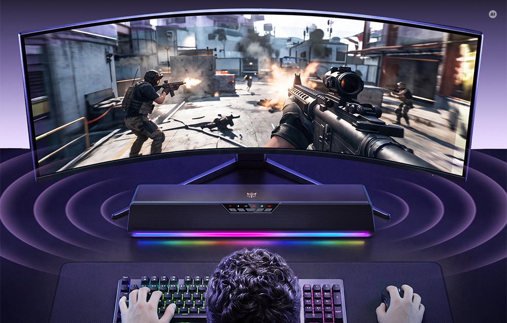 Ηχομπάρα Onikuma L13 με φωτισμό RGB τοποθετημένη κάτω από μια καμπύλη οθόνη κατά τη διάρκεια παιχνιδιού