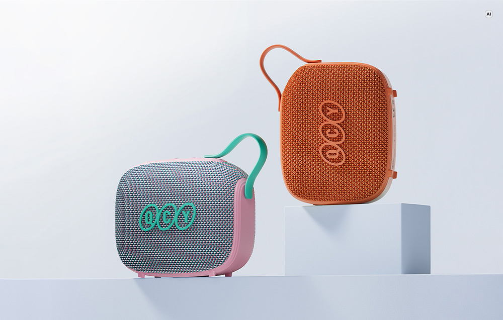 Δύο φορητά ηχεία Bluetooth QCY SP3 σε ροζ-γκρι και πορτοκαλί χρώμα με φόντο λευκό