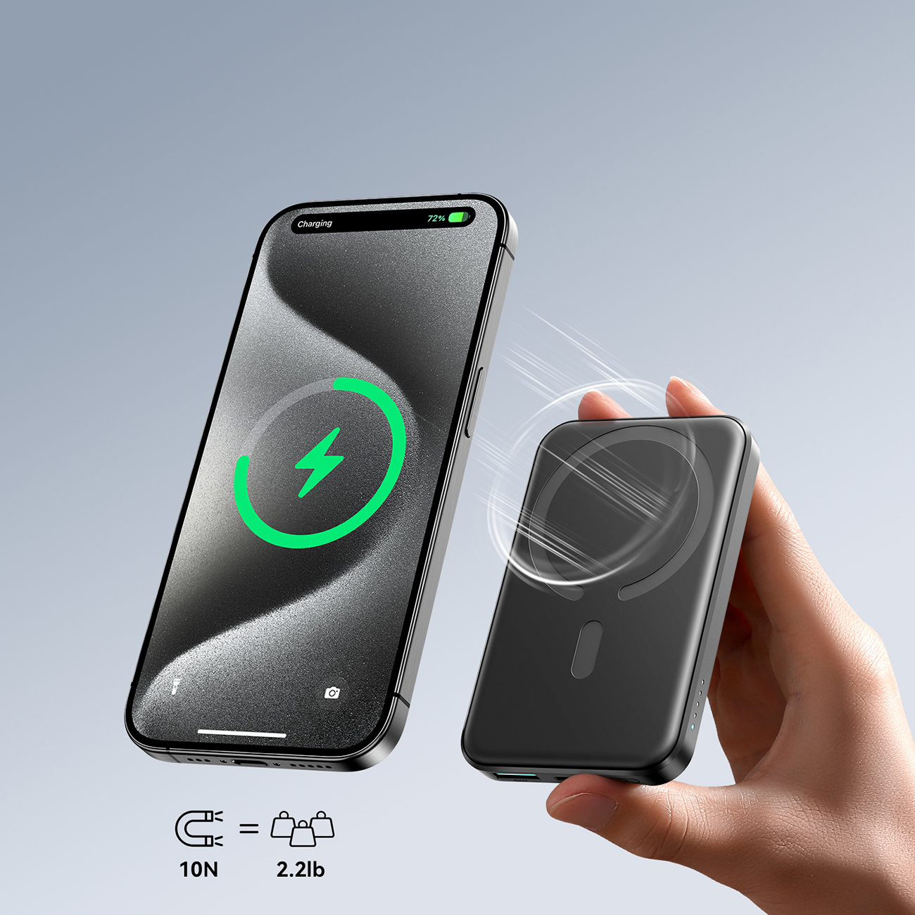 Το iPhone έλκεται από την ισχύ του μαγνήτη του Joyroom JR-W020 Mini Inductive Power Bank που κρατάτε στο χέρι σας